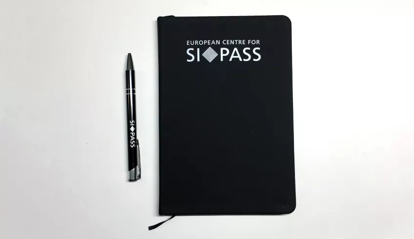 SI Conference notebook and pen